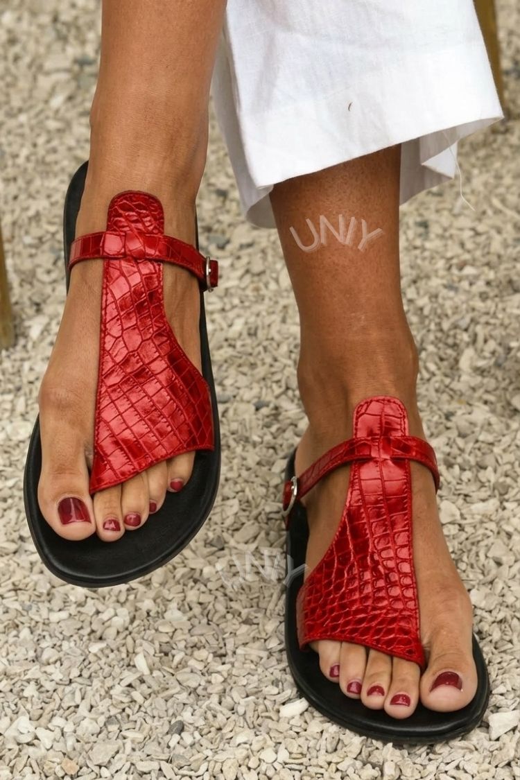 Crocodile effect flip-flops with strap and buckle on the ankle