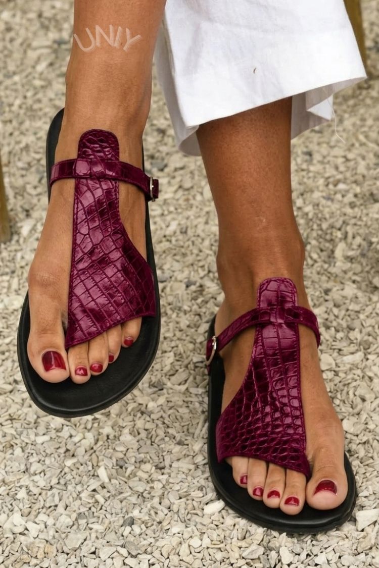 Crocodile effect flip-flops with strap and buckle on the ankle